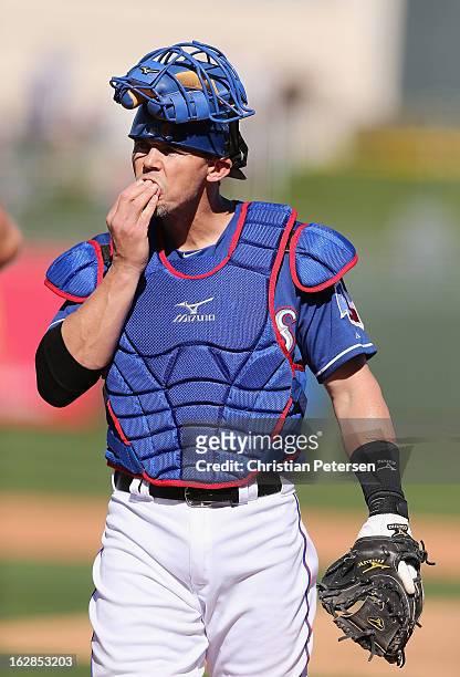 Catcher Eli Whiteside of the Texas Rangers in action during the spring training game against the Kansas City Royals at Surprise Stadium on February...
