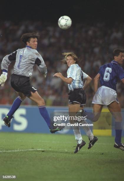 Claudio Canniggia of Argentina heads the ball past Walter Zenga the Italian goalkeeper during the World Cup Semi-Final at the San Paolo stadium in...