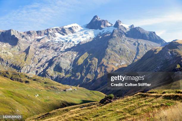 a man hiking in the french alps - rhone alpes stock pictures, royalty-free photos & images