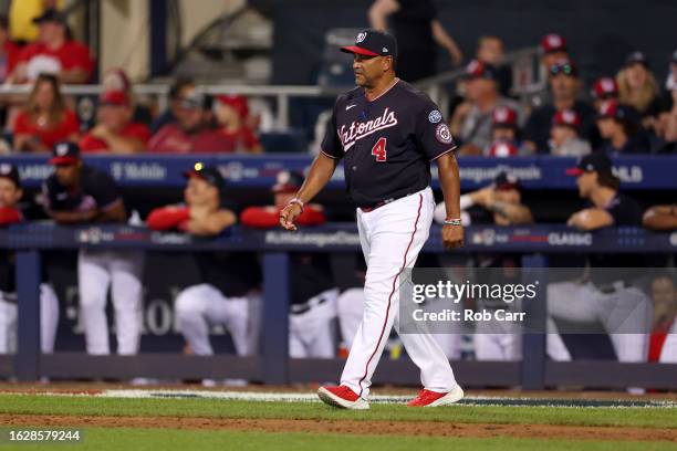 Manager Dave Martinez of the Washington Nationals makes a pitching change in the ninth inning against the Philadelphia Phillies during the 2023...