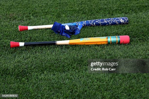 The pencil designed bat of Bryson Stott of the Philadelphia Phillies sits on the field before the start of the Phillies and Washington Nationals game...