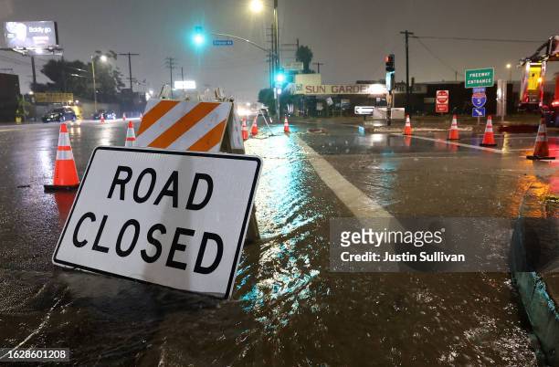 An entrance to southbound Interstate 5 is blocked due to flooding as tropical storm Hilary moves through the area on August 20, 2023 in Sun Valley,...