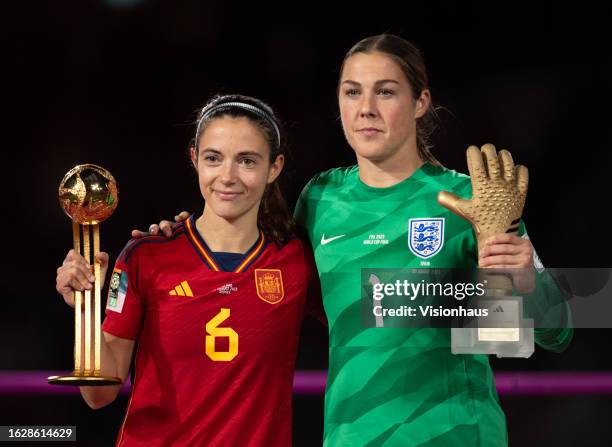 Aitana Bonmati of Spain poses with the Adidas Golden Ball trophy next to England goalkeeper Mary Earps posing with her FIFA Golden Glove trophy...