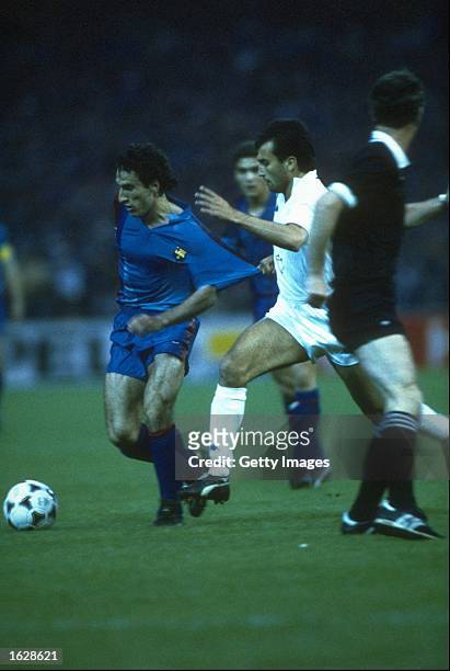 Pellegrini of Sampdoria holds back Berguirstain of Barcelona during the European Cup Winners Cup final at the Wankdorf Stadium in Berne, Switzerland....