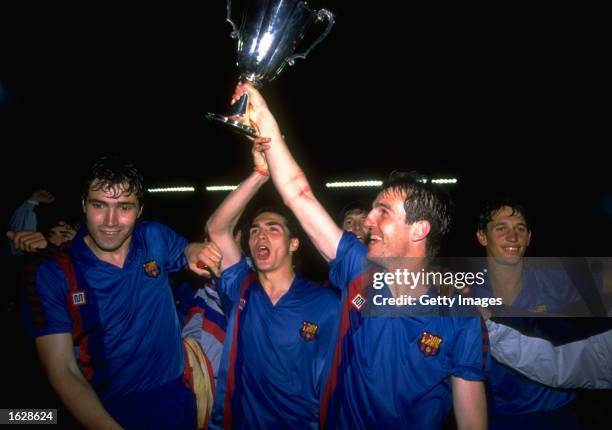 Roberto of Barcelona holds the trophy aloft and celebrates with his team mates including Gary Lineker after their victory in the European Cup Winners...