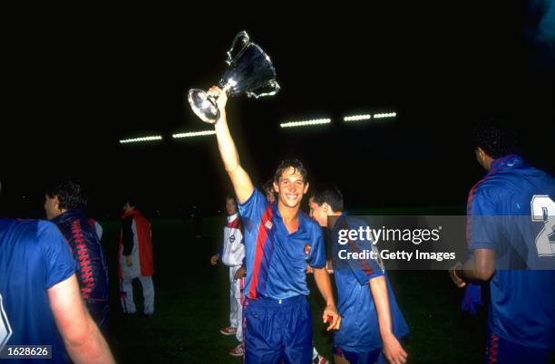 Gary Lineker of Barcelona holds the trophy aloft in celebration after their victory in the European Cup Winners Cup final against Sampdoria at the...