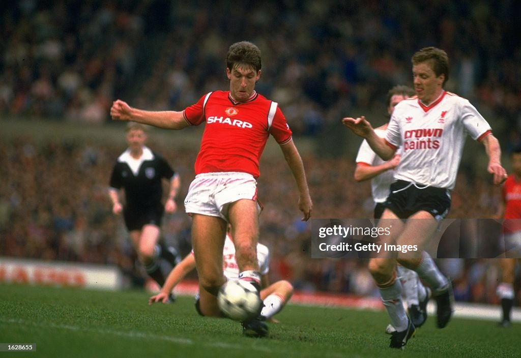 Norman Whiteside of manchester United and Steve Nicholl of Liverpool