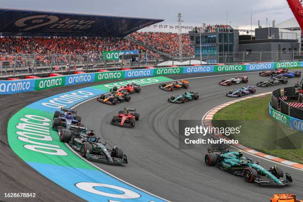 Race cars on track at the first lap at turn no 3 during the Dutch GP Formula 1 World Championship race. Heavy downpour rain led to red flag and...