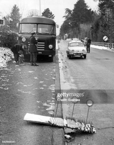 French Gendarmes at Evian laying traffic checks in the approach roads to town, 1962.