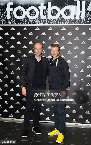 David Beckham and Zinedine Zidane attend an autograph session at adidas Performance Store Champs-Elysees on February 28, 2013 in Paris, France.