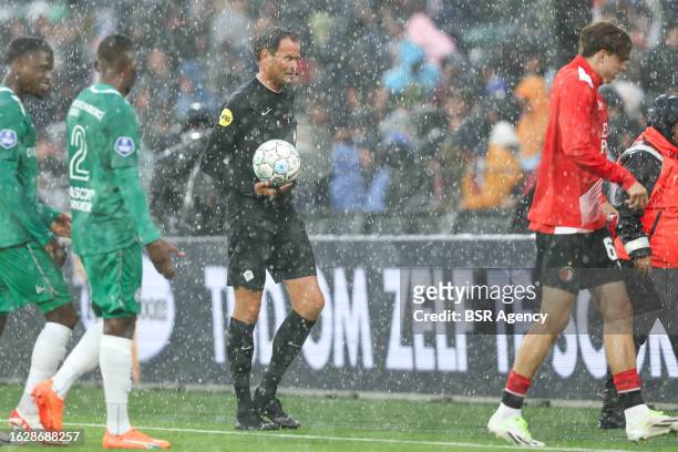 Referee Bas Nijhuis in the rain during the Dutch Eredivisie match between Feyenoord Rotterdam and Almere City FC at Stadion Feijenoord de Kuip on...