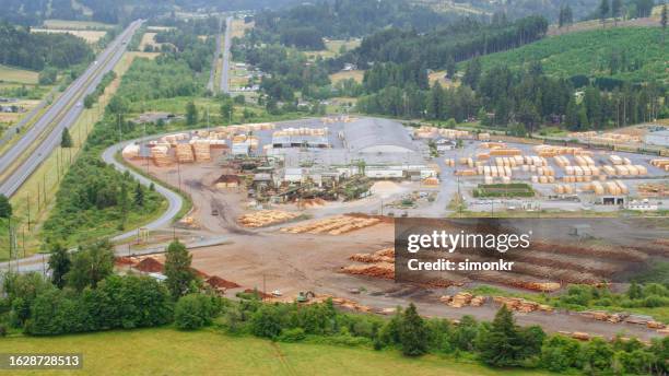 view of large lumber mill - logging mill stock pictures, royalty-free photos & images