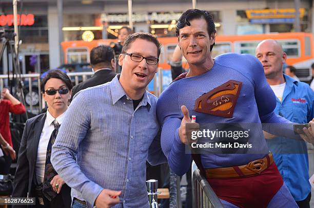 Director Bryan Singer and a fan in a costume attend the "Jack The Giant Slayer" footprint ceremony held at the TCL Chinese Theatre on February 28,...