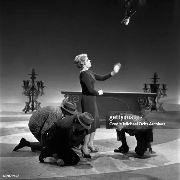 French singer and actress Line Renaud performs on The Ed Sullivan Show on October 12, 1958 in New York City, New York.