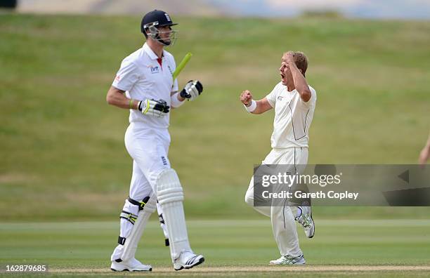 Neil Wagner of a New Zealand XI celebrates dismissing Kevin Pietersen of England during day three of the International Tour Match between the New...