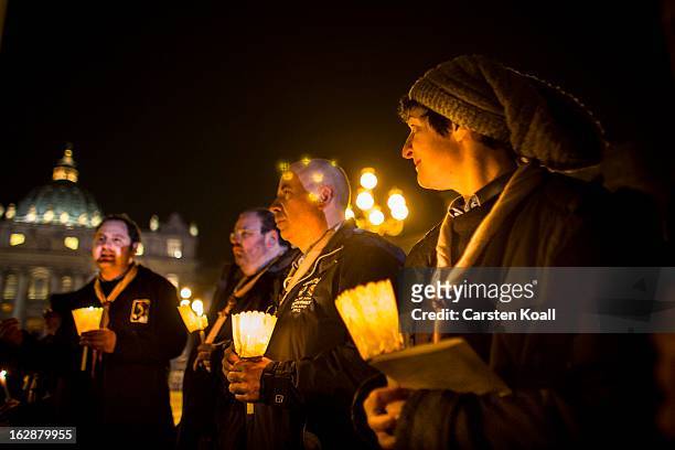 Group in St Peter's Square say prayers for Pope Benedict XVI in the moments after he ceased to be Pontiff at 20:00 CET on February 28, 2013 in...