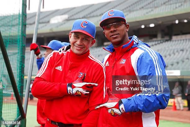 Frederich Cepeda and Yasmani Tomas of Team Cuba pose for a photo during the World Baseball Classic workout day at Hotto Motto Field on Tuesday,...