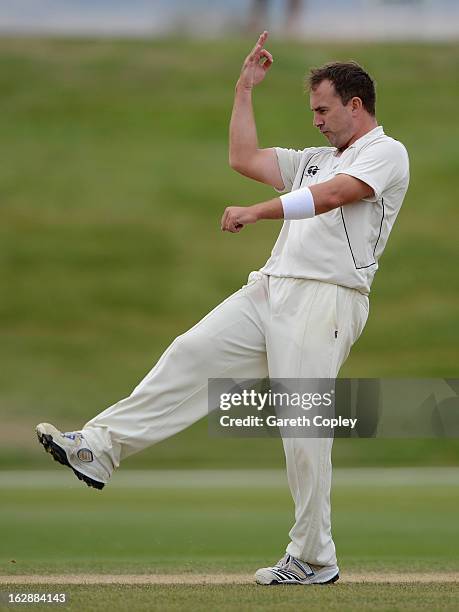 Mark Gillespie of a New Zealand XI celebrates dismissing Chris Woakes of England during day three of the International Tour Match between the New...