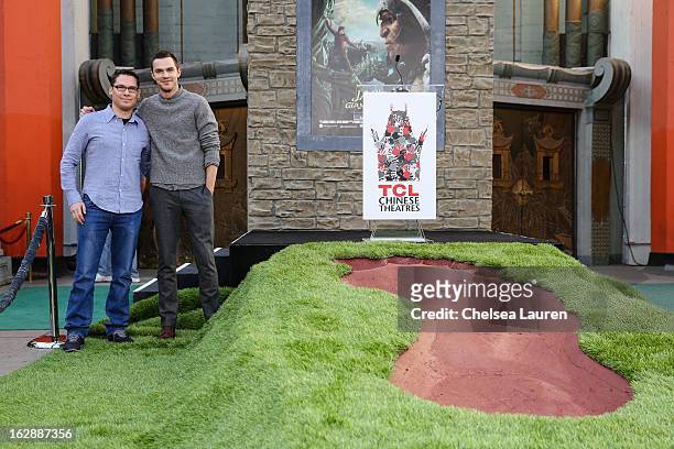 Director Bryan Singer and actor Nicholas Hoult attend the unveiling of a giant footprint for "Jack the Giant Slayer" at TCL Chinese Theatre on...