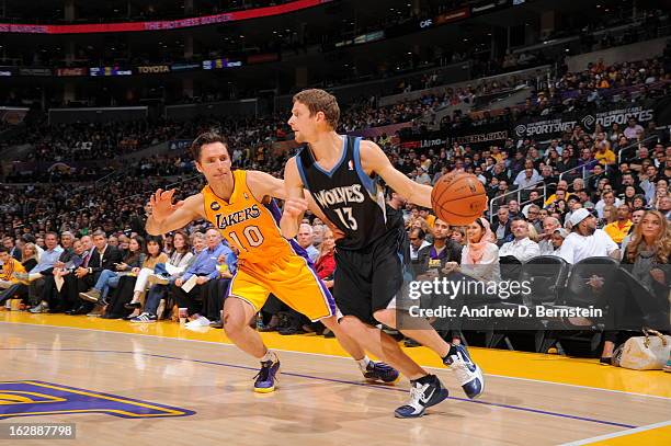 Luke Ridnour of the Minnesota Timberwolves dribbles against Steve Nash of the Los Angeles Lakers at Staples Center on February 28, 2013 in Los...