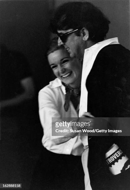 American actress Yvette Mimieux and author and screenwriter Terry Southern share a laugh on the set of 'The Desperate Hours' , 1967.