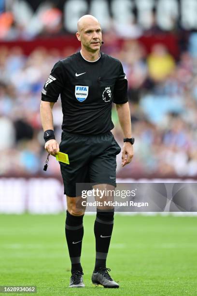 Referee Anthony Taylor looks on during the Premier League match between Aston Villa and Everton FC at Villa Park on August 20, 2023 in Birmingham,...