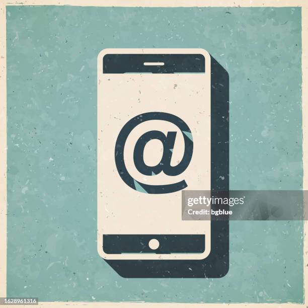 smartphone with at symbol. icon in retro vintage style - old textured paper - 'at' symbol stock illustrations