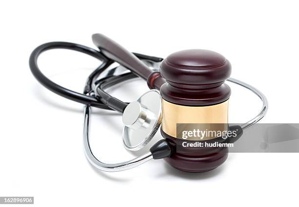 gavel and stethoscope isolated on white background - ethical treatment stock pictures, royalty-free photos & images