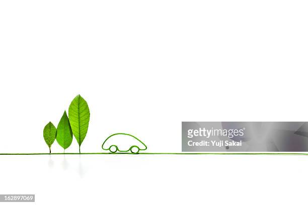 eco-car shaped   electric cord with standing leave - alternative fuel vehicle stock pictures, royalty-free photos & images