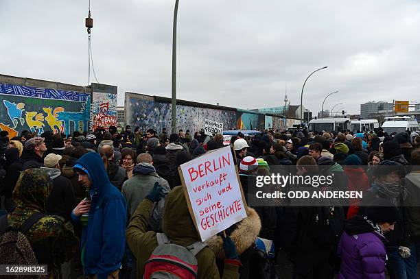 Banner reading 'Berlin sells itself and its history' during a protestors against the removal of a section of the East Side Gallery, a 1,3 km long...