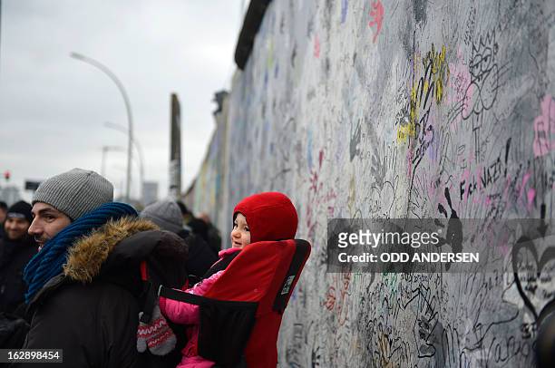 People protest against the removal of a section of the East Side Gallery, a 1,3 km long remainder of the Berlin Wall, for a housing construction...