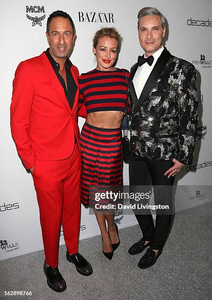 Personality Cat Deely poses with Decades owners Christos Garkinos and Cameron Silver at the Harper's BAZAAR celebration of Cameron Silver and...
