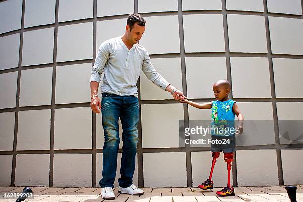 Year old amputee, Kitso got to visit his hero, the "Blade Runner", athlete Oscar Pistorius at his house on November 24, 2011 in Pretoria, South...