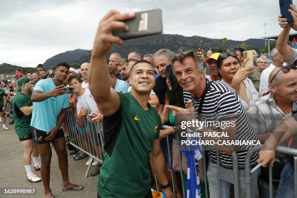 South's Africa rugby union fullback Kolbe Cheslin pose for a selfie with supporters after a training in Biguglia close from Bastia on August 28, 2023...