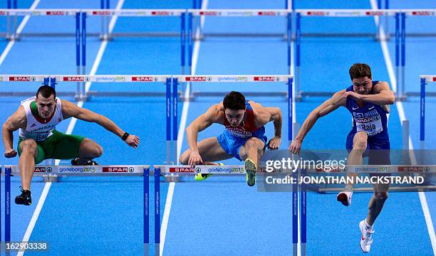 Estonia's Andres Raja , Russia's Konstantin Shabanov and Hungary's Balazs Raji compete during the 2nd heat of the 60m Hurdles Men event at the...