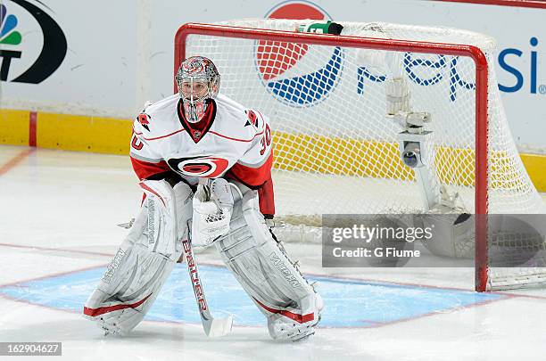 Cam Ward of the Carolina Hurricanes defends the goal against the Washington Capitals at the Verizon Center on February 26, 2013 in Washington, DC.