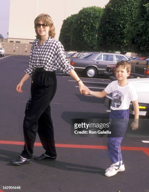 Actress Jill Eikenberry and son Max Tucker attend the "Oliver & Company" Burbank Premiere on November 6, 1988 at Walt Disney Studios in Burbank,...