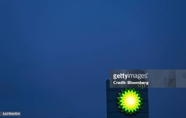 An illuminated sign stands on the forecourt of a BP gas station, operated by BP Plc, in Upminster, U.K., on Thursday, Feb. 28, 2013. BP Plc's push to...