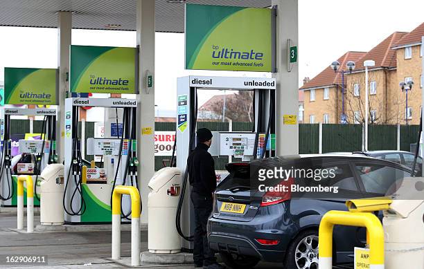Motorist refuels his Ford Fiesta automobile with unleaded gasoline at a BP gas station, operated by BP Plc, in Newbury Park, U.K., on Thursday, Feb....