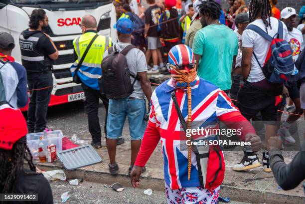 Man dressed in Union Jack and an alien mask on his face. The mask says 'Brexit' takes part during the carnival. The Notting Hill Carnival is one of...