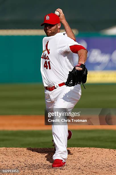 Mitchell Boggs of the St. Louis Cardinals throws a pitch during a game against the Miami Marlins at the Roger Dean Stadium on February 28, 2013 in...