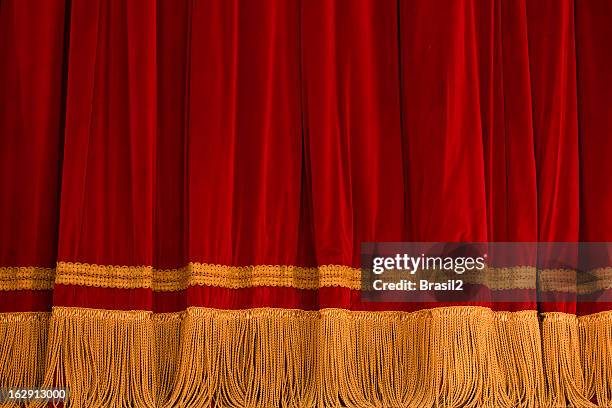 red courtain theater - gold fringe stock pictures, royalty-free photos & images