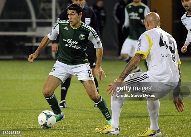 Diego Valeri of the Portland Timbers moves the ball in on Daniel Majstorovic of AIK during the second half of the game at Jeld-Wen Field on February...