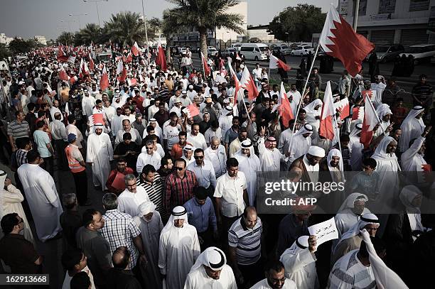 Bahraini protesters march during an anti-government demonstration in the village of Karranah, west of Manama, on March 1, 2013. Bahrain has witnessed...