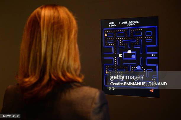 The Museum of Modern Art Senior Curator of Architecture and Design Paola Antonelli plays the video game Pac-Man during a preview of the MoMa's...