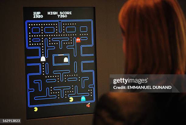 The Museum of Modern Art Senior Curator of Architecture and Design Paola Antonelli plays the video game Pac-Man during a preview of the MoMa's...