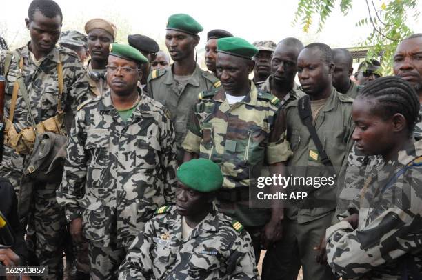 Mali junta leader Captain Amadou Sanogo poses surrounded by his fellow soldiers in Bamako on March 22, 2012. Coup leaders in Mali Today ordered all...