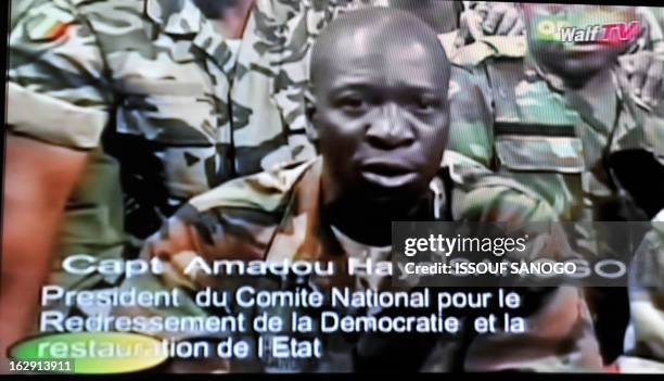 Photo of a TV screen taken on March 22, 2012 shows Mali junta leader Captain Amadou Sanogo announcing a curfew in Bamako starting from March 22...