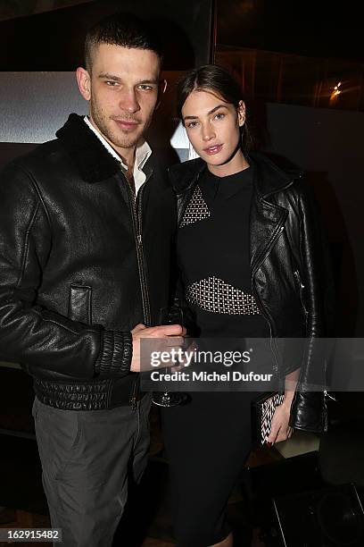 Crista Cober and guest attend Swarovski 'Paris Haute Couture' Exhibition as part of Paris Fashion Week on February 28, 2013 in Paris, France.