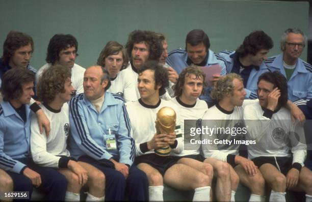 Group photograph of Franz Beckenbauer and the West German team with the trophy after the World Cup final against Holland at the Olympiastadion in...